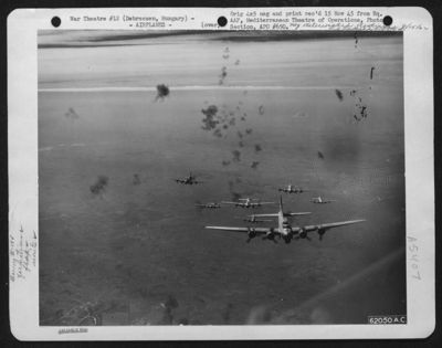 Flak Bursts Around Boeing B-17 'Flying Fortresses' Of The 15Th Air Force, Enroute To Bomb Enemy Installations At Debreczen, Hungary, 21 Sept. 1944.