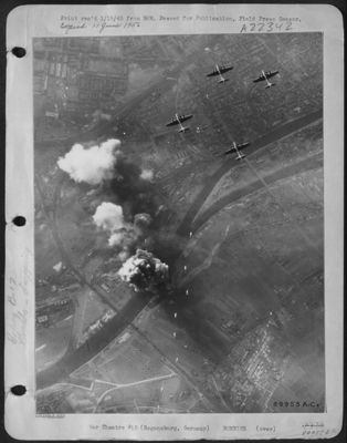 A String Of Bombs Head For The Already Burning Target As Boeing B-17 Flying Fortresses Of The 15Th AF Attacked The Oil Storage Faciltieis At Regensburg, Germany, On 28 Dec. 1944. The Forts Scored Hits On Storage Tanks, Distillation Plant, And Rolling Sto