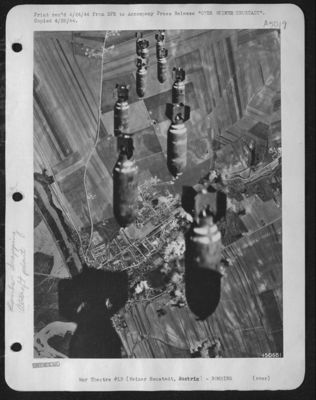 These bombs have just left the bomb bays of heavy bombers of the U.S. Army 15th AF and are about to fall on one of the most important aircraft production centers in Europe, the Wiener Neustadt plant which turns out ME-109 fighter planes
