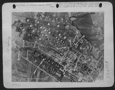 Romano Americano Refinery at Ploesti, Rumania was attacked on 15 July 44 by heavy bombers. This damage photo shows good concentration of hits despite fact that target was completely invisible, with stabilization plant (1) damaged storage tanks