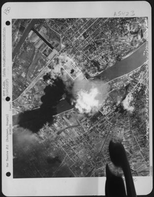 A Cloud Of Smoke Towers High In Ther Sky Over The Oil Refinery At Budapest, Hungary After Planes Of The 465th Bombardment Group, 15Th Air Force Dropped Their Bombs There On September 17, 1944.