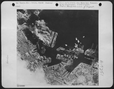 Toulon, France-Reaching out beyond the immediate bottle for Italy, the Strategic Air Force (15th AAF) hammered the naval and submarine base at Toulon in Southern France on Feb. 4. In the picture, taken from a Fortress in one of the early Groups to