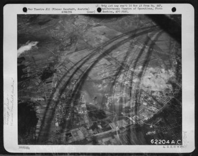Shadows, Cast By Vapor Trails From Boeing B-17 "Flying Fortresses"Of The 15Th Air Force, Attacking The Aircraft Factory At Wiener Neustadt, Austria, Have Been Caught By The Camera In This Unusual Photograph. Smoke And Dust Rise From The Target Area. 23