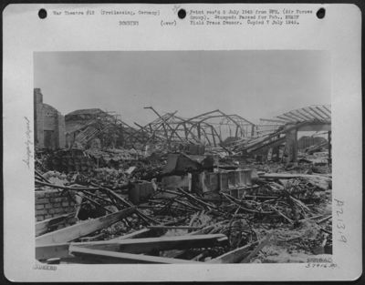 Twisted Steel Framework Is All That Remains Of A Warehouse At The Freilassing Ordnance Depot, North Of Salzburg, Austria, Where Arms And Supplies Were Stored For The Germans' Proposed Defense Of The Southern Area Of 'National Redoubt'. However, 9Th Air D