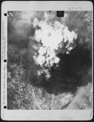 Bombs Dropped By Planes Of The 456th Bomb Group, 747th Bomb Squadron Cause Smoke To Billow Up Over Installations In Budapest, Hungary On 2 July 1944.