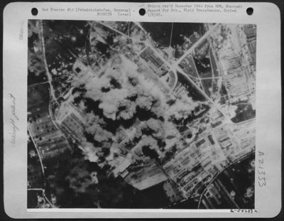 A close pattern of 15th AAF bombs cover the Zeppelin Works at Friedrichshafen, Germany, Accomplished in perfect style, this mission handed a decided setback to the enemy's production of jet-propelled aircraft and parts for others.