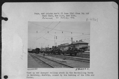Tied Up And Damaged Rolling Stock In The Marshalling Yards In Salzburg, Austria, Caused By The Bombing Of The 15Th Air Force.