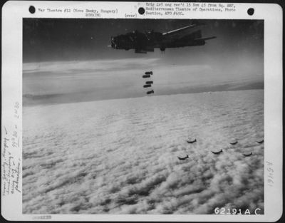 Bombs Away! A String Of Bombs Is Released By A Boeing B-17 "Flying Fortress", Part Of A Formation Attacking Enemy Installations At Nove Zamky, Hungary On 7 October 1944.