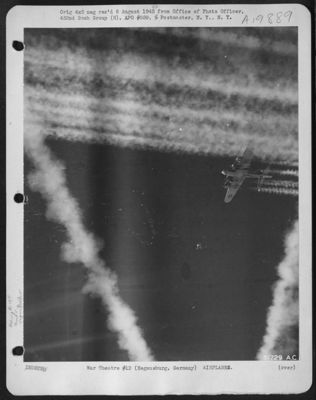 Boeing B-17 Flying Fortresses Of The 452Nd Bomb Group Leaves Another Lane Of Vapor Trails To Those Left By Preceding Formation Enroute To Regensburg, Germany 25 Feb. 1944. Taken By S/Sgt. F. Ferreri.