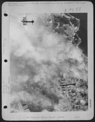SOFTENING UP THE COAST. Flying Fortresses of the U.S. Army 9th and 15th Air Forces during recent attacks on Nazi-held coastal points in France. Attack by Boeing B-17 Flying Fortresses on the naval base are at Toulon, south coast of France. Note