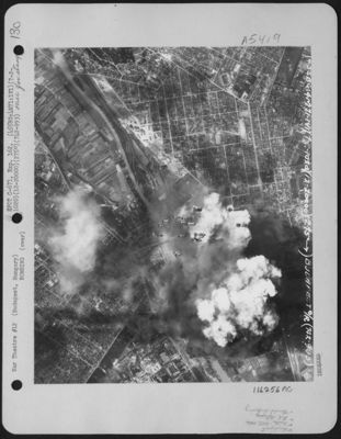 As Smoke From Previous Bomb Bursts Covers The Oil Refinery At Budapest, Hungary, More Bombs Streak Dounward To Add To The Destruction, During A Raid By Planes Of The 455th Bomb Group, 742Nd Bomb Squadron, 15Th Air Force On July 2, 1944.