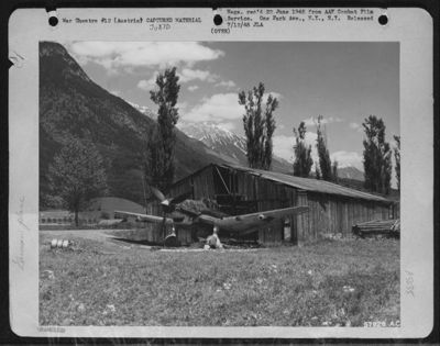 Enemy 'Stuka' [Junkers Ju 87D-3(N) Of 3./Nsgr.9 A/C Is E8+Gl] Hidden In Shed On Airdrome West Of Innsbruck, Austria. June 1945.