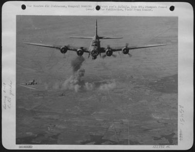 Boeing B-17 "Flying Fortresses" Of The 15Th Air Force Are Shown Coming Off The Target; Railroad Yards At Debreczen, Hungary On 21 Sept. 44. Black Smoke Rose High Into The Sky, Probably Caused By A Strike On An Oil Tank Car.