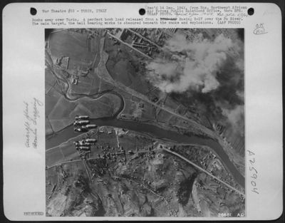 Bombs away over Turin. A perfect bomb load released from a Boeing B-17 over the Po River. The main target, the ball bearing works is obscured beneath the smoke and explosions.